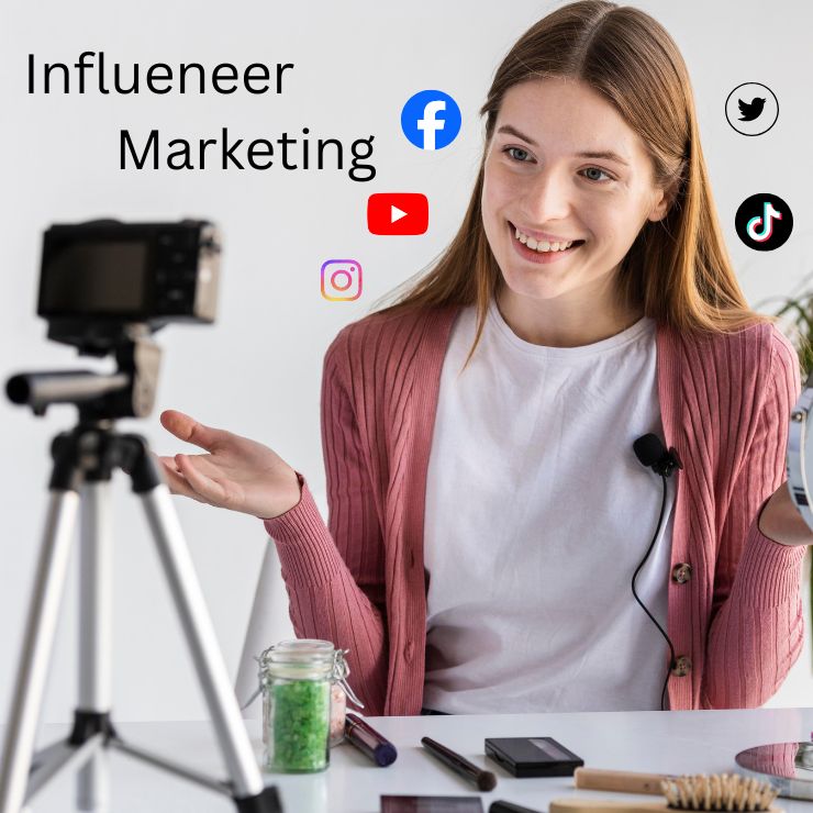 In this picture, a woman is promoting makeup products by showing them, which is known as influencer marketing; additionally, there are some social media icons behind the woman.